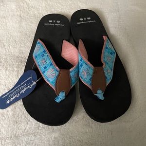 Never worn size 8 women’s flip flops .